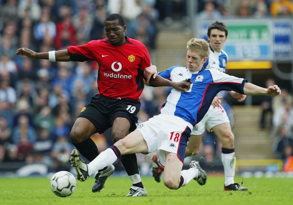 BLACKBURN, ENGLAND - MAY 1:  Jonathan Stead of Blackburn Rovers tackles Eric Djemba-Djemba of Manchester United during the FA Barclaycard Premiership match between Blackburn Rovers and Manchester United at Ewood Park on May 1, 2004 in Blackburn, England.  (Photo by Laurence Griffiths/Getty Images)