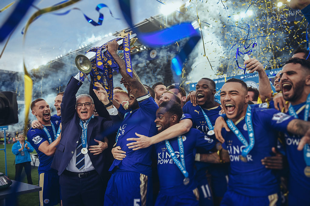 LEICESTER, ENGLAND - MAY 07: [EDITORS NOTE: THIS IMAGE WAS PROCESSED USING DIGITAL FILTERS] Captain Wes Morgan and manager Claudio Ranieri of Leicester City lift the Premier League Trophy after the Barclays Premier League match between Leicester City and Everton at The King Power Stadium on May 7, 2016 in Leicester, United Kingdom. (Photo by Michael Regan/Getty Images)
