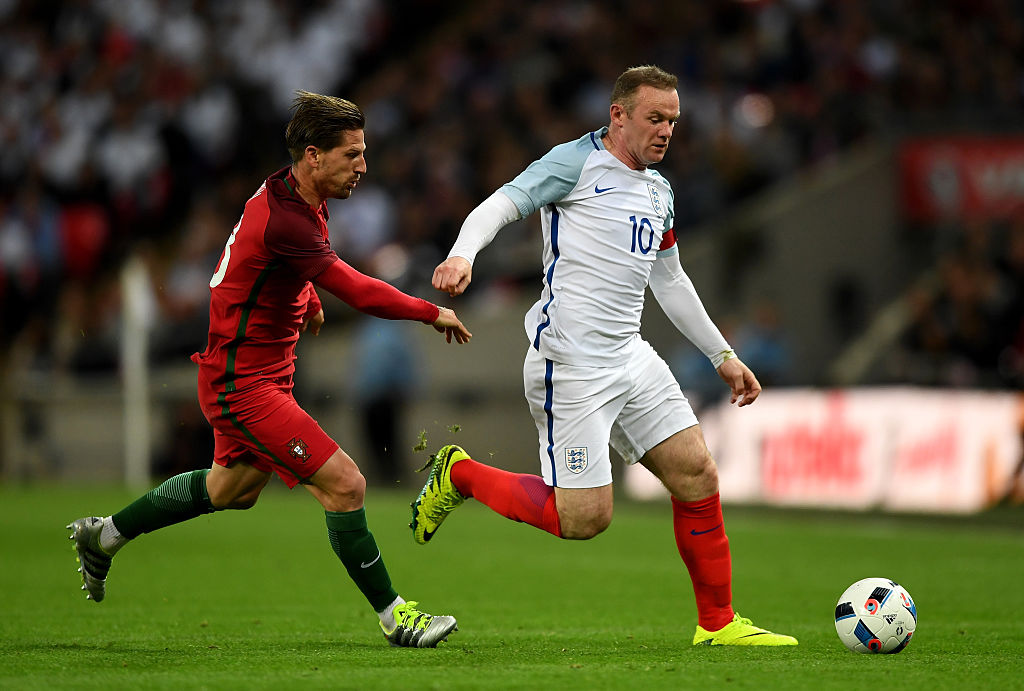 LONDON, ENGLAND - JUNE 02:  Wayne Rooney of England is chased by Adrien Silva of Portugal during the international friendly match between England and Portugal at Wembley Stadium on June 2, 2016 in London, England.  (Photo by Shaun Botterill/Getty Images)