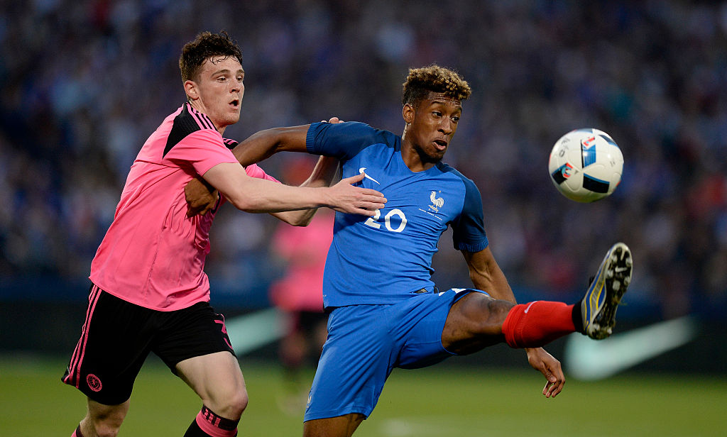 METZ, FRANCE - JUNE 04: Kingsley Coman of France (R) is challenged by Charlie Mulgrew of Scotland during the International Friendly between France and Scotland on June 4, 2016 in Metz, France. (Photo by Daniel Kopatsch/Getty Images)