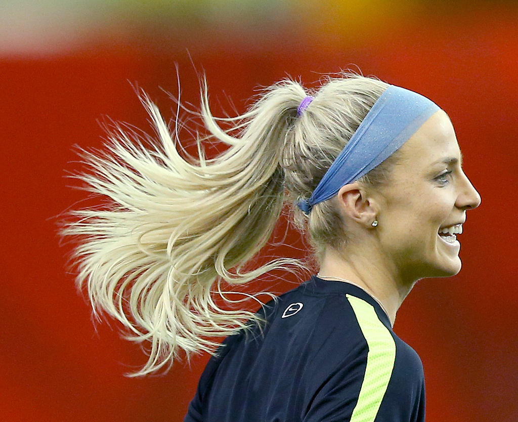MONTREAL, QC - JUNE 29:  Julie Johnston #19 of the U.S. warms up during training at Olympic Stadium on June 29, 2015 in Montreal, Canada.  (Photo by Elsa/Getty Images)