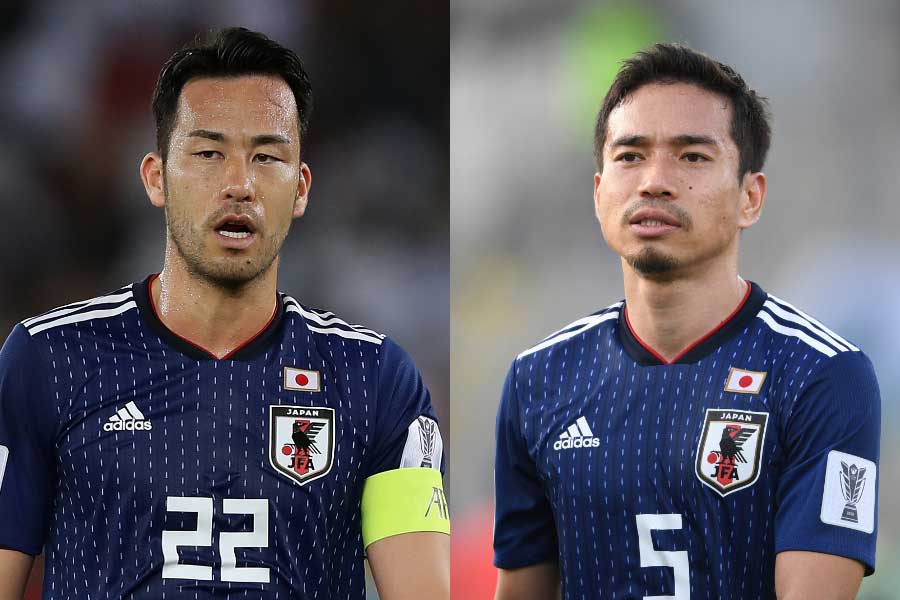 吉田と長友が取材エリアで軽妙なやり取りを見せた【写真:Getty Images】